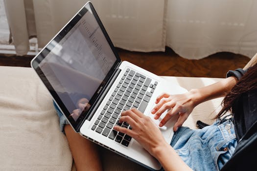 person researching keywords on a laptop